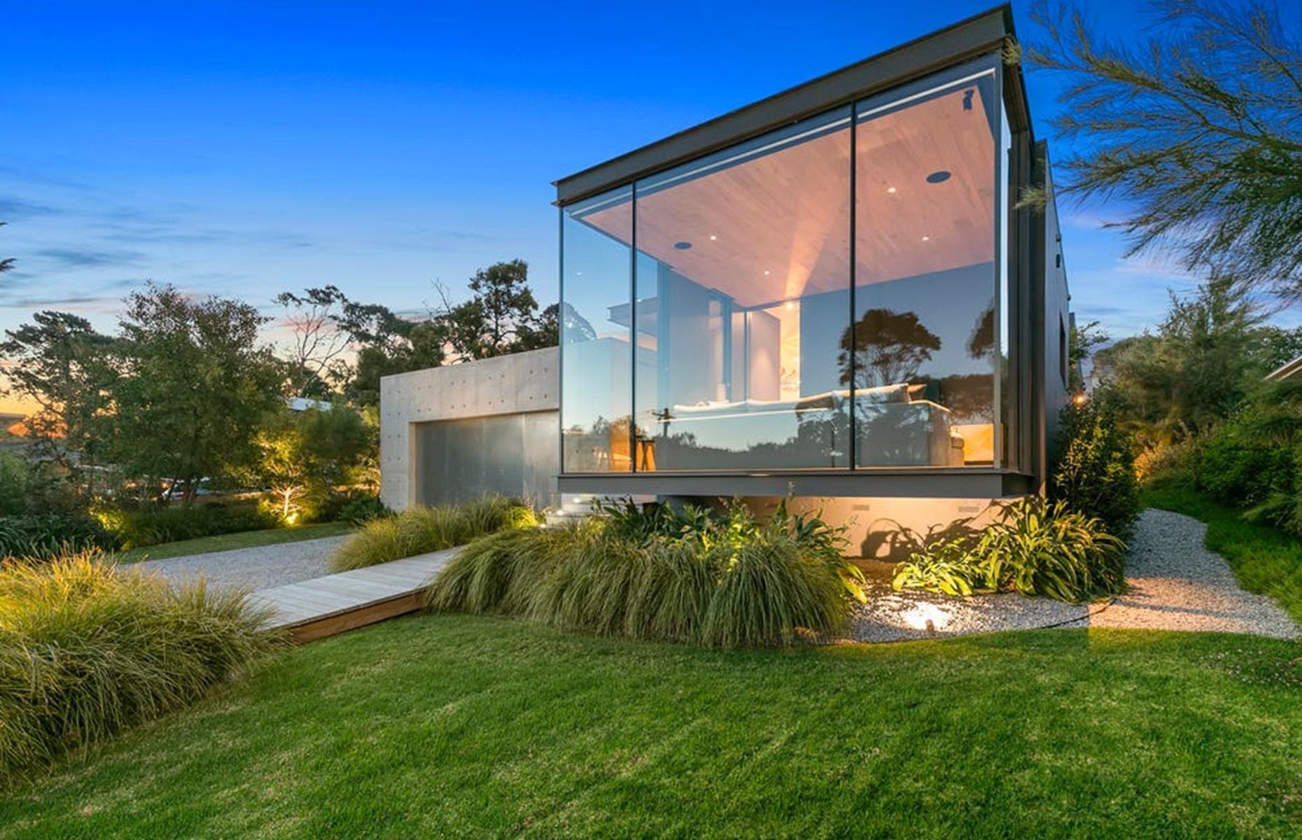 <p>Thanks to the home's stunning glazed gable, the occupant can enjoy wonderful views of the garden, which comes complete with a swimming pool and alfresco living and dining areas – perfect for making the most of Australia's enviable climate.</p>