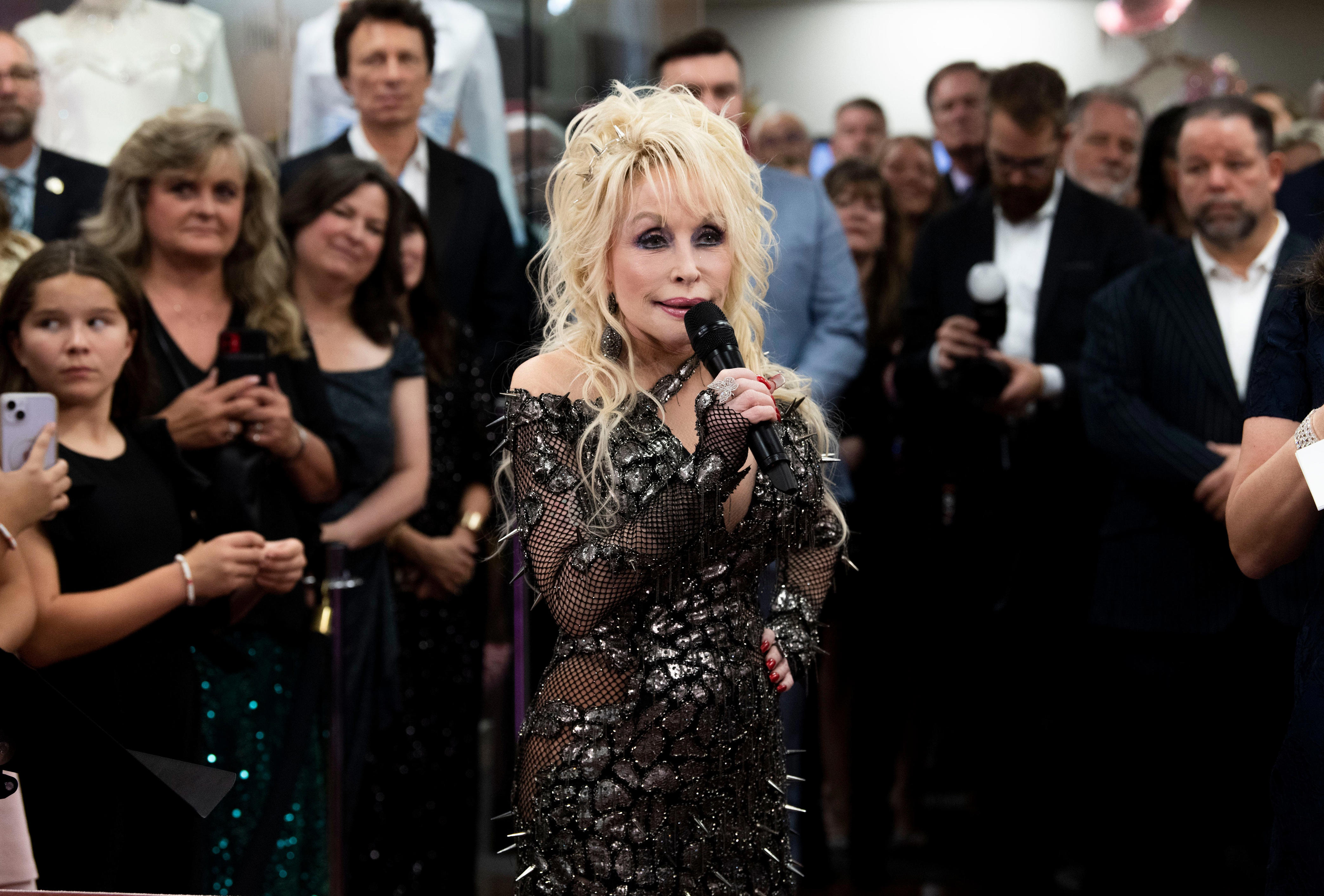 What Dolly Parton said about her fashions on display: 'That's a lotta livin' in those clothes.'