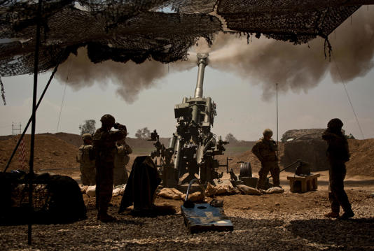 In this file photo, US soldiers from the 82nd Airborne Division fire artillery in support of Iraqi forces fighting Islamic State militants from their base east of Mosul. AP Photo/Maya Alleruzzo