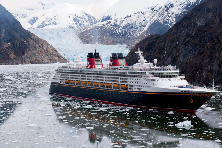 The Disney Wonder cruise ship sails past glaciers in Tracy Arm Fjord as part of its Alaska itinerary. Nestled between 3,000-foot high granite walls, the narrow, twisting Tracy Arm Fjord weaves through the Tongass National Forest for roughly 35 miles. (Diana Zalucky, photographer)