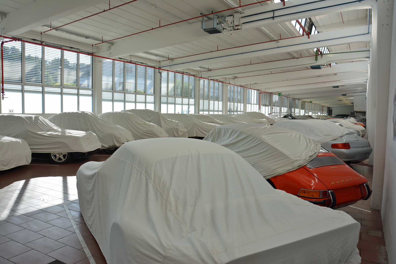 <p>Covers protect cars from prolonged exposure to direct sunlight, dust, and prying eyes. While some of the sheets exceptionally came off during our visit, Klein informed us a handful of cars would <strong>remain hidden</strong> regardless of how nicely we asked. Some of the prototypes stored in the facility have never been shown to the public before.</p>