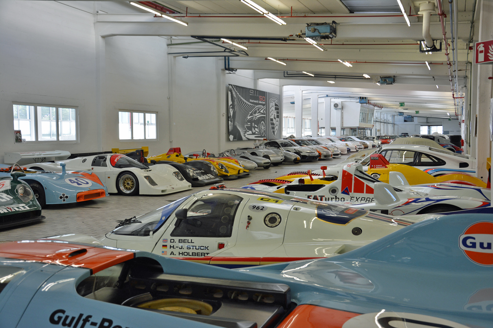<p>Racing has defined Porsche since its earliest days, so it comes as no surprise that a large chunk of the warehouse is reserved for the company’s race cars. Endurance racers that triumphed at <strong>Le Mans</strong> share the floor with dusty rally cars and eye-catching one-offs built for world record attempts.</p>