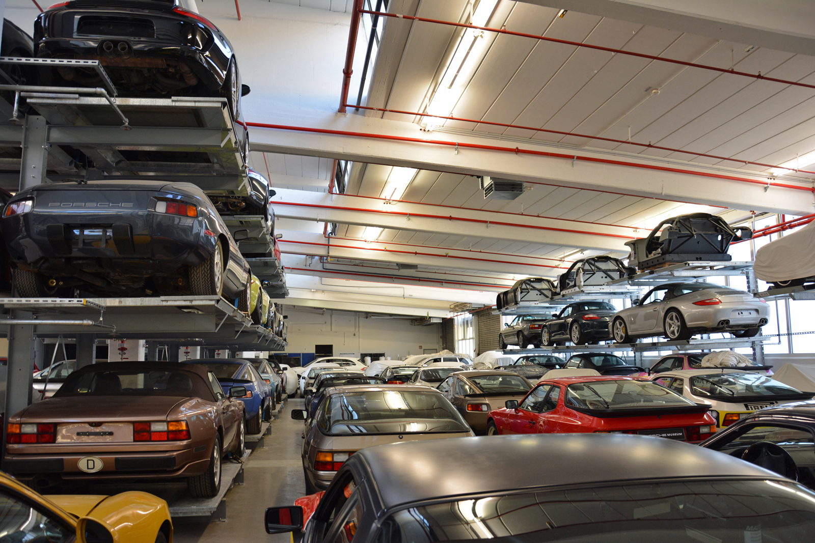 <p>As Porsche’s lineup grows, so does its collection. Cars are stacked three-high on massive shelves that line the walls, but parts of the warehouse nonetheless look like New York during <strong>rush hour in the olden days when we got traffic jams</strong>. An average of <strong>15 cars</strong> join the fleet annually, and Klein acknowledged storage space is not endless.</p>