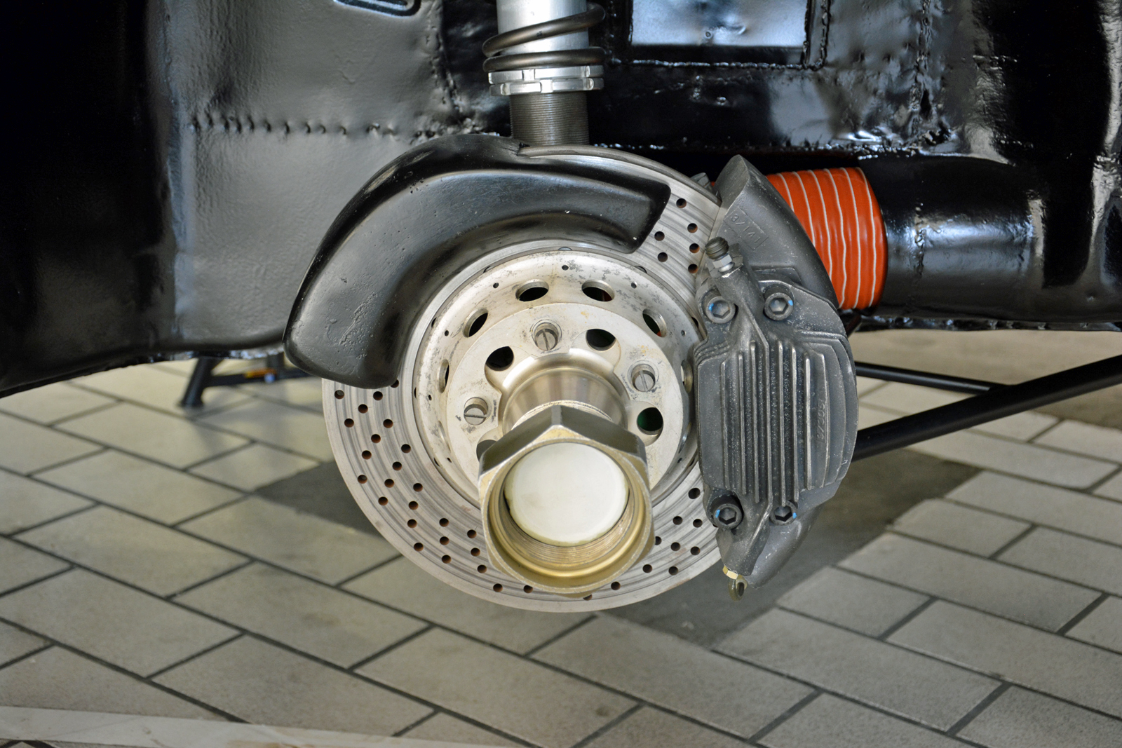 <p>The 911’s stock brakes weren’t enough to safely bring the RSR’s turbocharged fury to a stop. The mechanical upgrades consequently included a model-specific braking system with drilled rotors and 917-style finned brake calipers. The RSR also received center-locking wheels and a revised suspension setup.</p>
