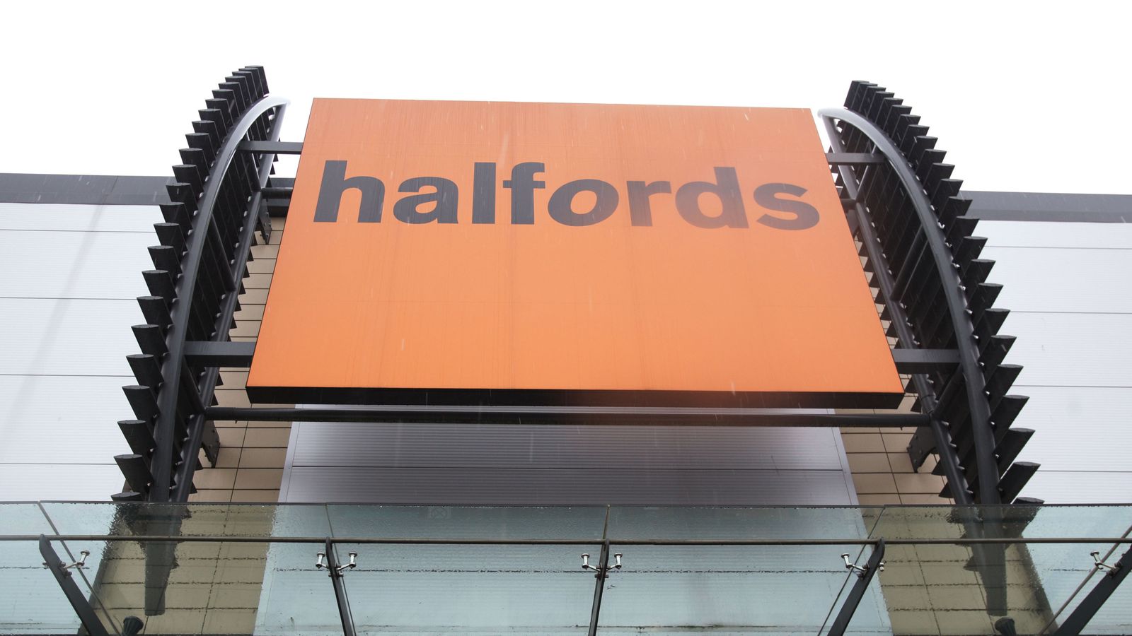 halfords slashes profit forecasts as wet weather hits sales