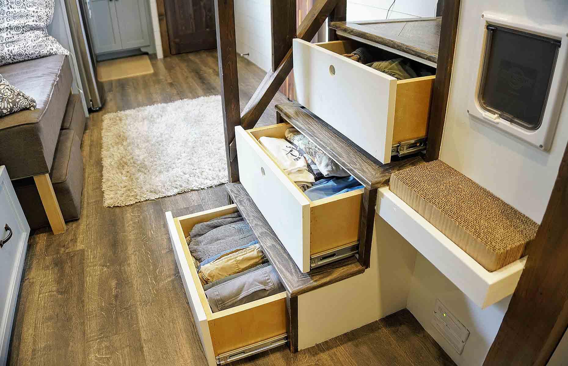<p>In a pocket-sized property, utilising every available inch is essential, especially the redundant spaces that are often taken for granted in traditional homes.</p>  <p>Tiffany's most ingenious storage hack has to be the built-in drawers underneath the stair treads – home to Tim's clothes. As well as Oliver's enclosed litter box, the staircase also conceals the hot water tank and a cubby hole for storing toothbrushes and toiletries.</p>