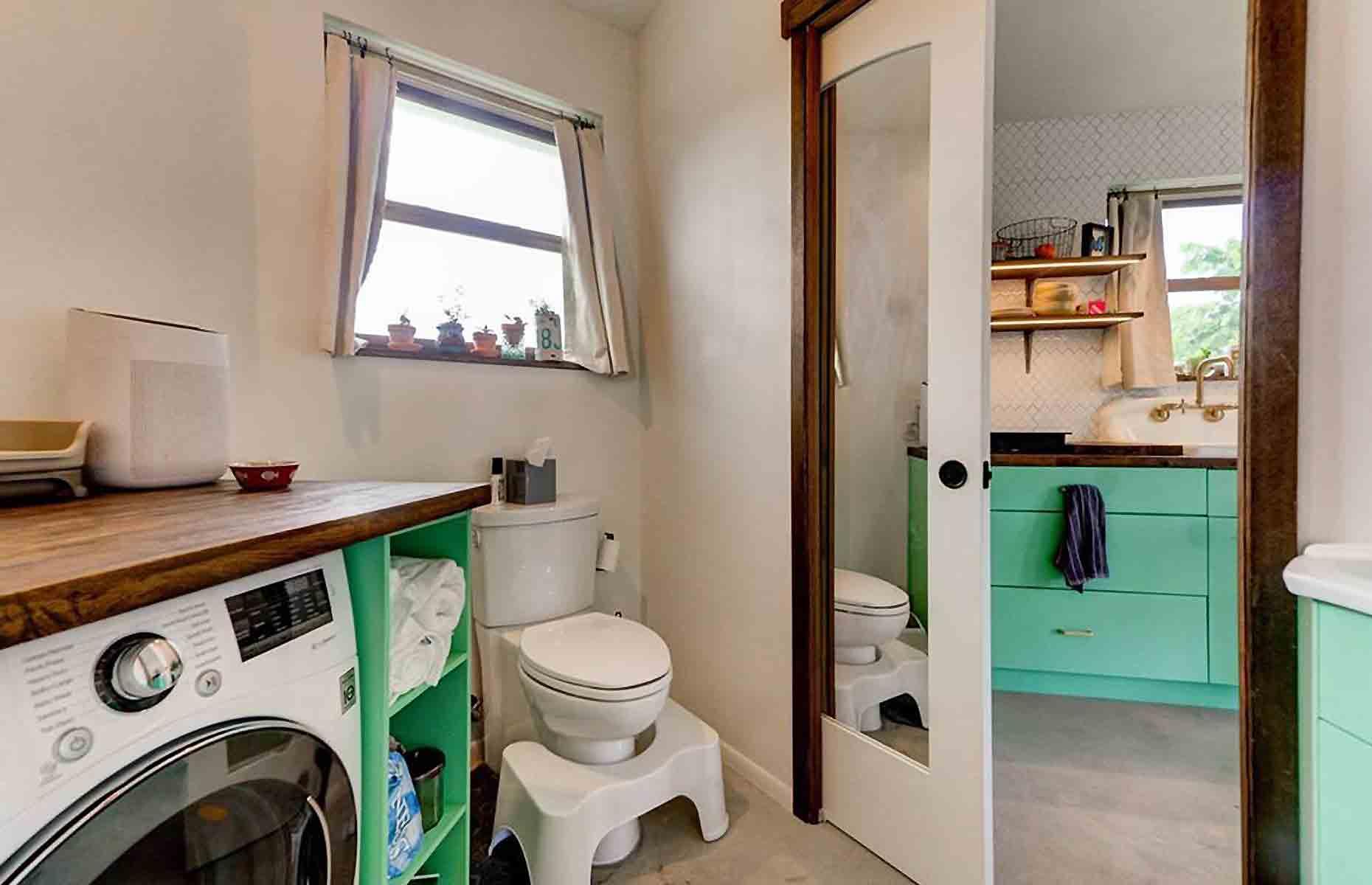 <p>The modern bathroom is home to yet more thrifty finds, from a high-end toilet, complete with wave-activated flush, bagged for free from Craigslist, to the $15 (£12) mirrored door, worth $300 (£243), picked up from Habitat for Humanity. </p>  <p>“We had a leftover butcher's block countertop from the kitchen, so I was able to take a scrap of that and create a counter space on top of the washer-dryer so you can fold clothes and what not”, Tim adds.</p>