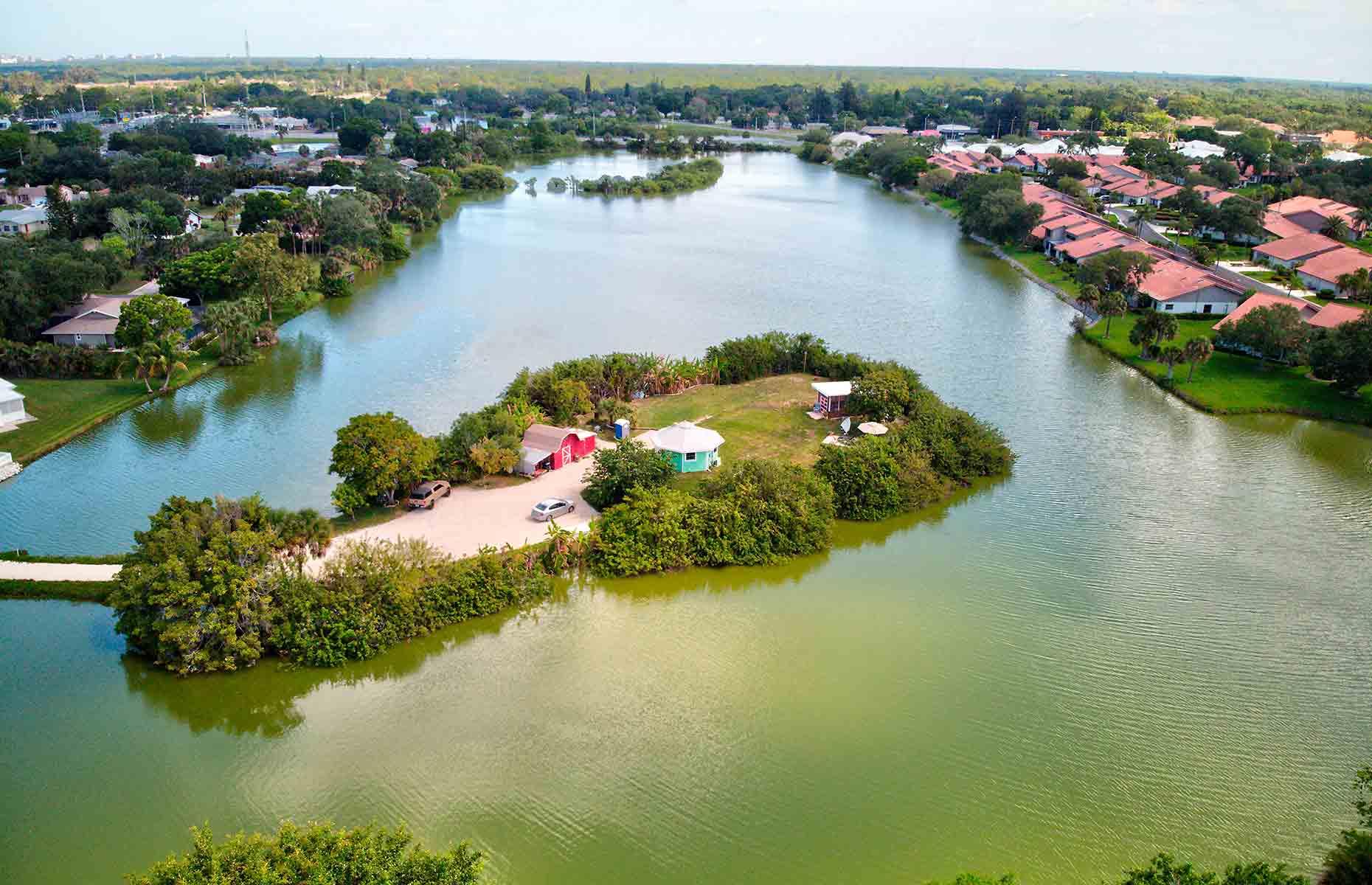 <p>Nestled in the middle of a 12-acre lake, only a few rundown storage buildings stood on the property, now known as Shellmate Island. But with its idyllic surroundings and bountiful fruit trees, the location, pictured here after the overhaul, was undoubtedly special. “It took a lot of work <span>–</span> it was rusty gold <span>–</span> so you take the rust off and you’ve got gold”, Tim explains. </p>