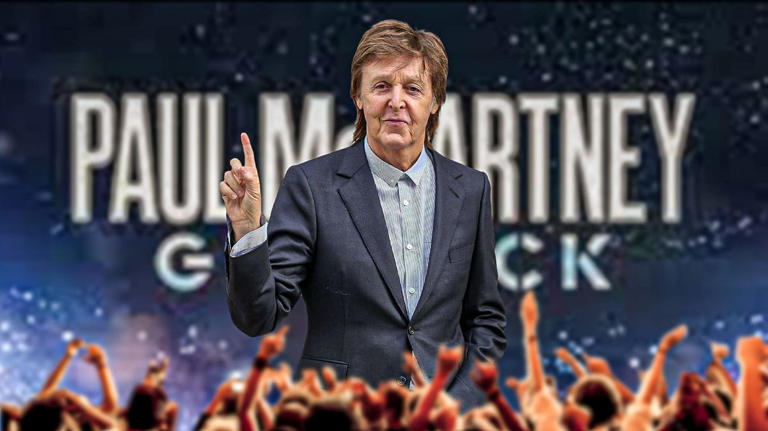 Paul McCartney in front of Got Back tour logo.