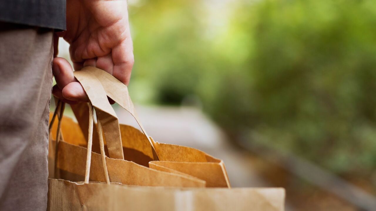 ‘they are fleecing us’: major shopping outlets slammed over paper bag prices