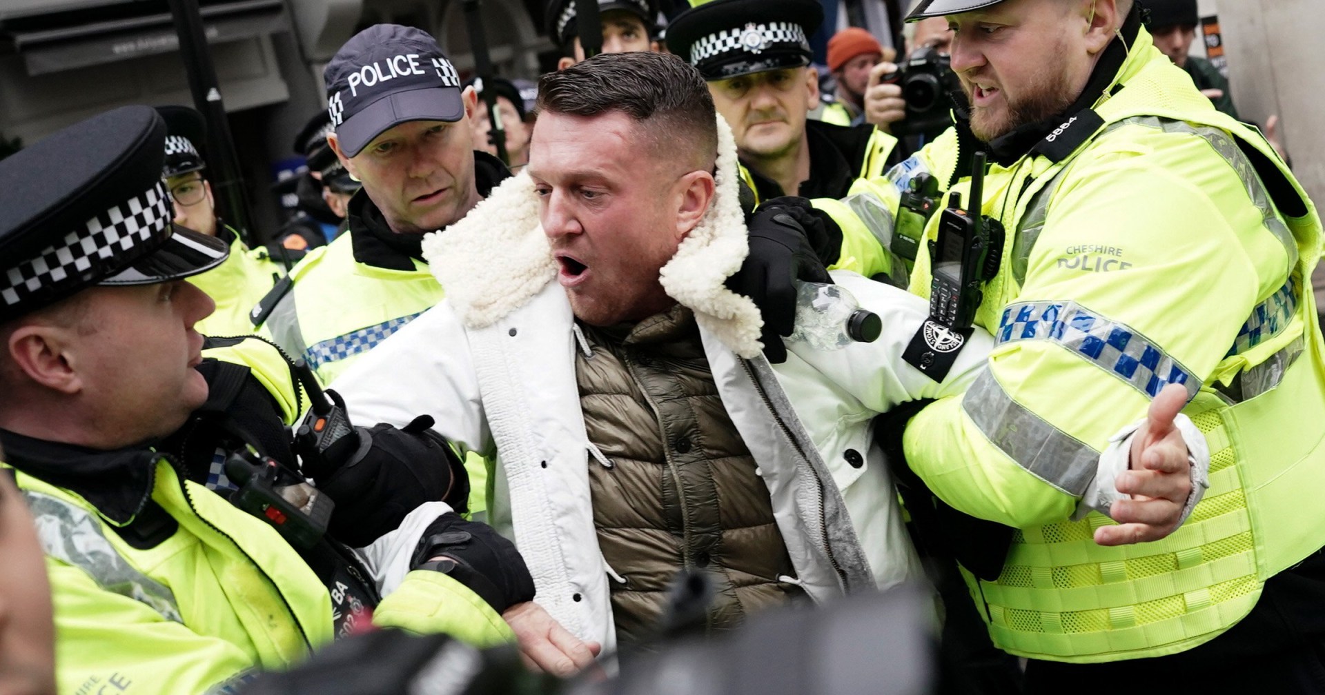 tommy robinson charged after arrest at antisemitism rally in london