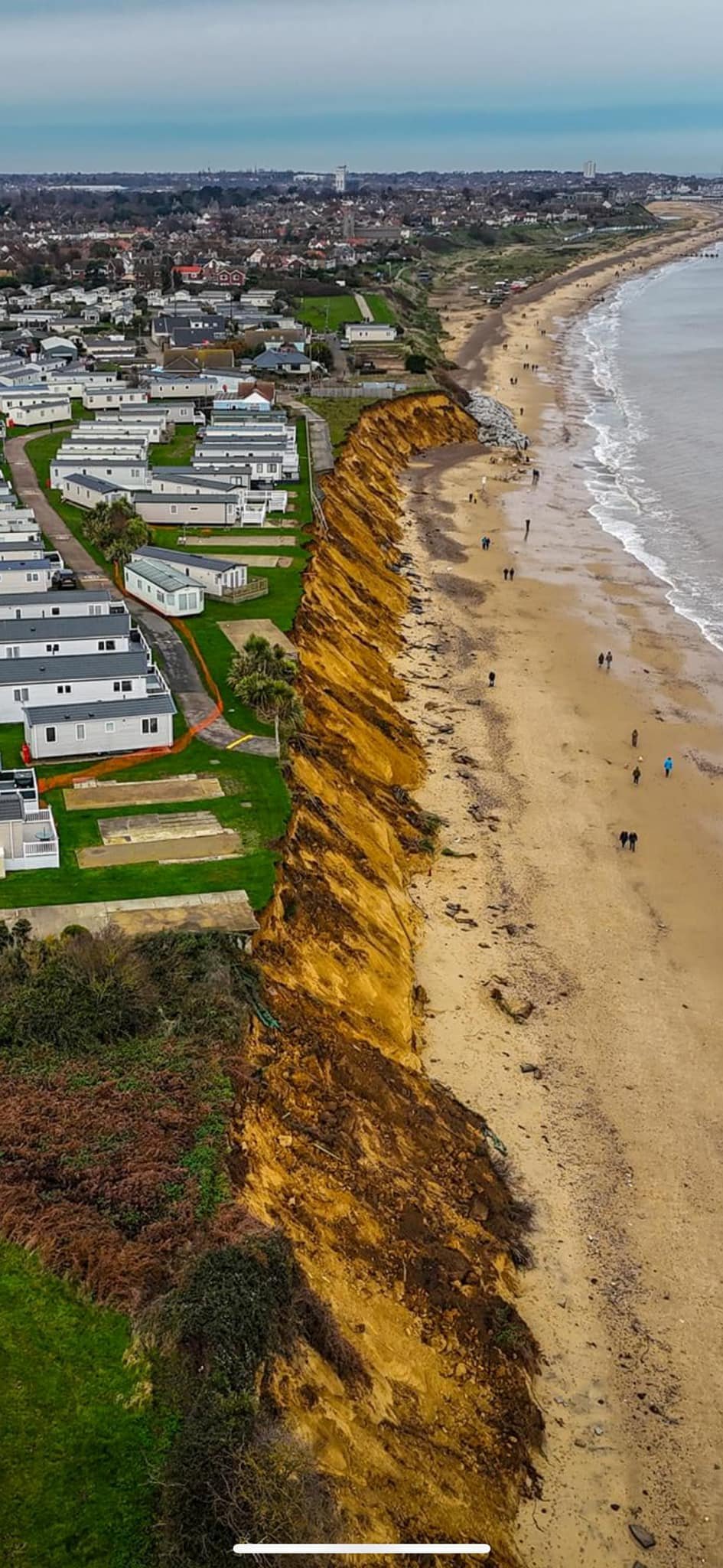 another landslip leaves homes dangerously close to toppling into the sea