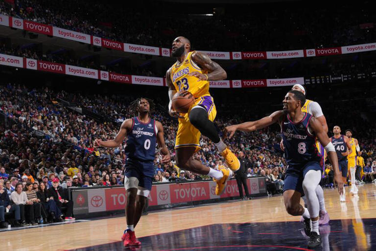 Lakers star LeBron James drives to the basket during a 138-94 loss to the Philadelphia 76ers on Monday night. The 44-point loss was the worst of James' NBA career. ((Jesse D. Garrabrant / NBAE via Getty Images))