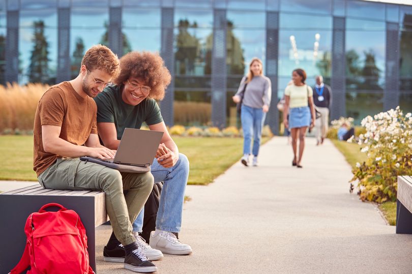 Ex student. Два студента разговаривают. Students sitting from behind.