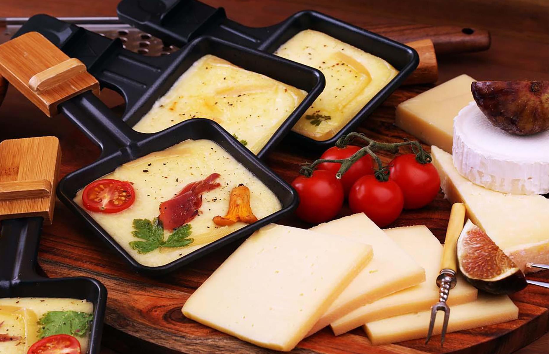 <p>Gooey cheese on top of everything? Yes please! This board pairs raclette cheese with roasted potatoes, breadsticks, cherry tomatoes, crackers and chutney. If you have a raclette grill, use it to melt your cheese before placing it on a heat-resistant board. If you don't have one, use a cast-iron pan to melt the cheese in the oven, then pour it over your arranged toppings.</p>