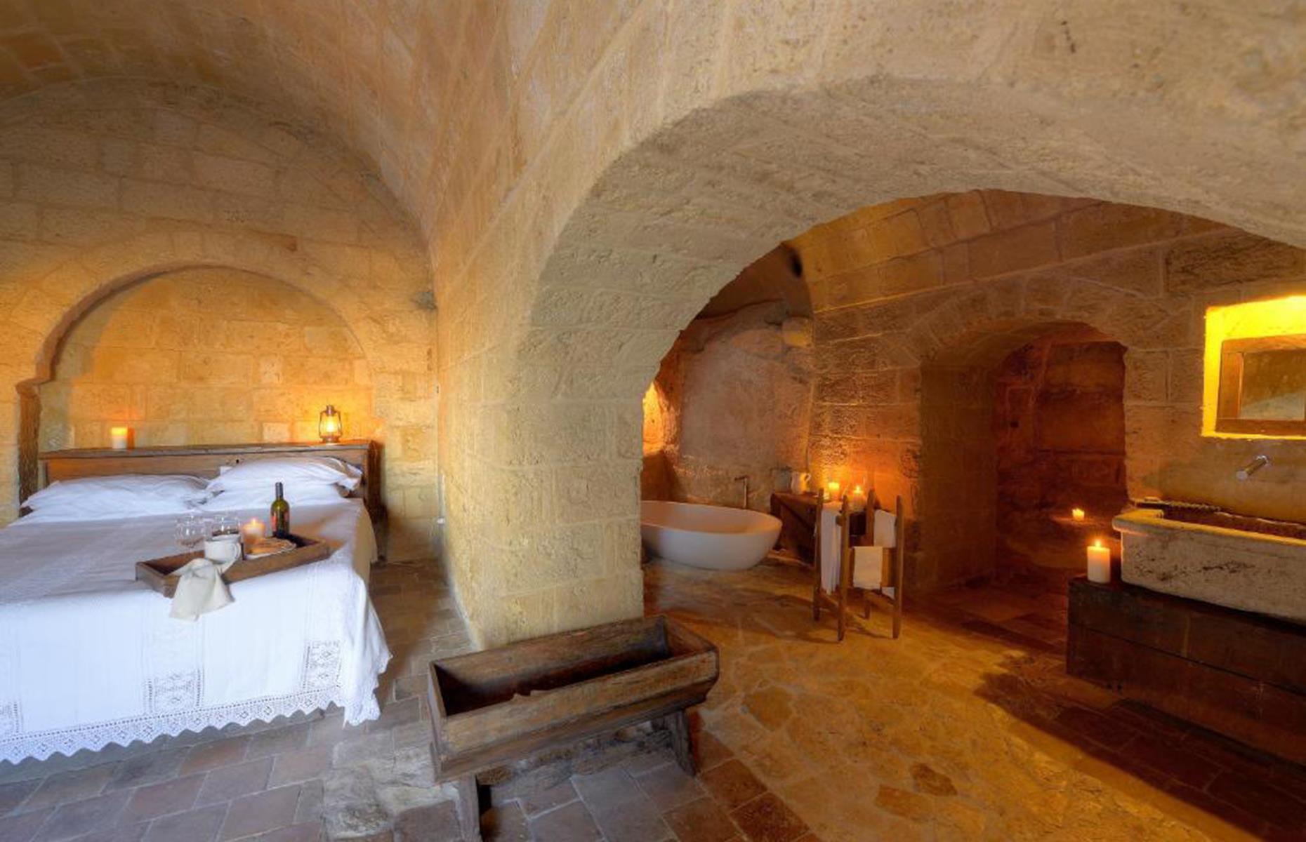 <p>Another Matera hotel, the stunning, candle-lit caves of Sextantio Le Grotte della Civita have been restored from abandoned ancient dwellings. A luxury retreat with a twist, the architecture retains its original shape and materials, but now comes with trappings of modern luxury like cozy king beds, bathtubs, and hand-woven sheets. The rooms are set in the oldest parts of the complex, while a former church is now a restaurant perfect for romantic dinners. You can even join a cooking course to learn the art of pasta making – including how to make regional shapes like cavatelli and orecchiette.</p>