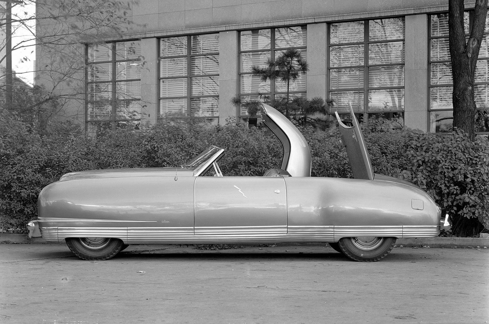 <p>The Chrysler Thunderbolt wasn't a small car, but it could seat just two people as its retractable hard top was stowed behind the cabin – then behind that was the luggage bay. Nick-named "the Push-Button Car", the Thunderbolt's roof, windows and retractable headlights were all electrically controlled.  Six Thunderbolts were made, all trimmed differently, for displays across the US.</p>