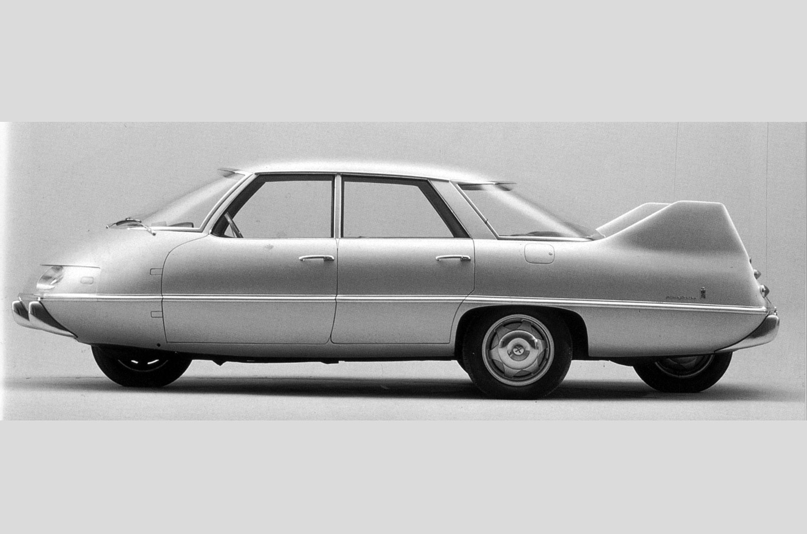 <p>We're struggling to work out what the benefits are of a rhomboidal wheel layout – that is one up front, one at the rear and two in the middle. Mounted over one of the central wheels was a Fiat 1100 engine and by honing the aerodynamics (the CD was just 0.2) the Pininfarina X could travel swiftly and frugally. But whichever way you looked at it this was one hideous concept.</p>
