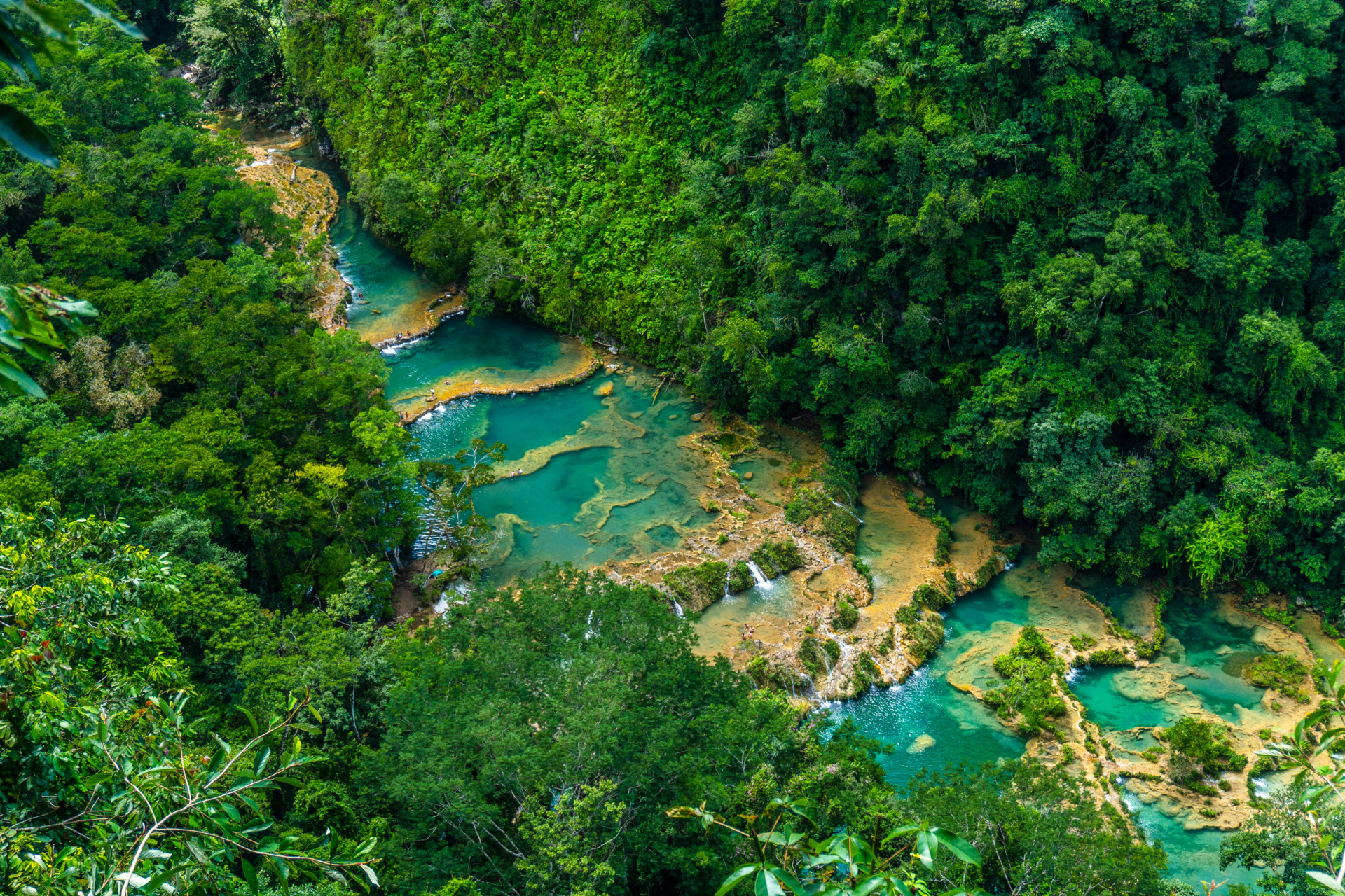 <p>Tucked away in the dense jungle of northern Guatemala is a natural wonder comprising a series of amazing blue rock pools and waterfalls known as Semuc Champey.</p>
