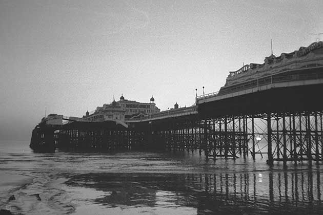 <p>If you were looking for a fun-filled seaside British holiday in the 1800s, there was no better place to visit than West Pier in Brighton. During its heyday, The West Pier saw millions of visitors annually, many of whom were there to experience the concert hall that was added on in 1916. Popularity began to decline after WWII, and the concert halls were replaced by a funfair and tearoom. It still couldn't attract enough people, so it was sold to a local company in 1965.</p> <p>Even they couldn't meet the increased maintenance cost and filed for bankruptcy. By 1975, the pier was closed to the public and fell into disrepair. Two major sections collapsed in 2002, while more portions were destroyed by two arsonist fires. It was completely demolished in 2010 after being declared destroyed beyond repair. Now, the i360 stands in its place. </p>