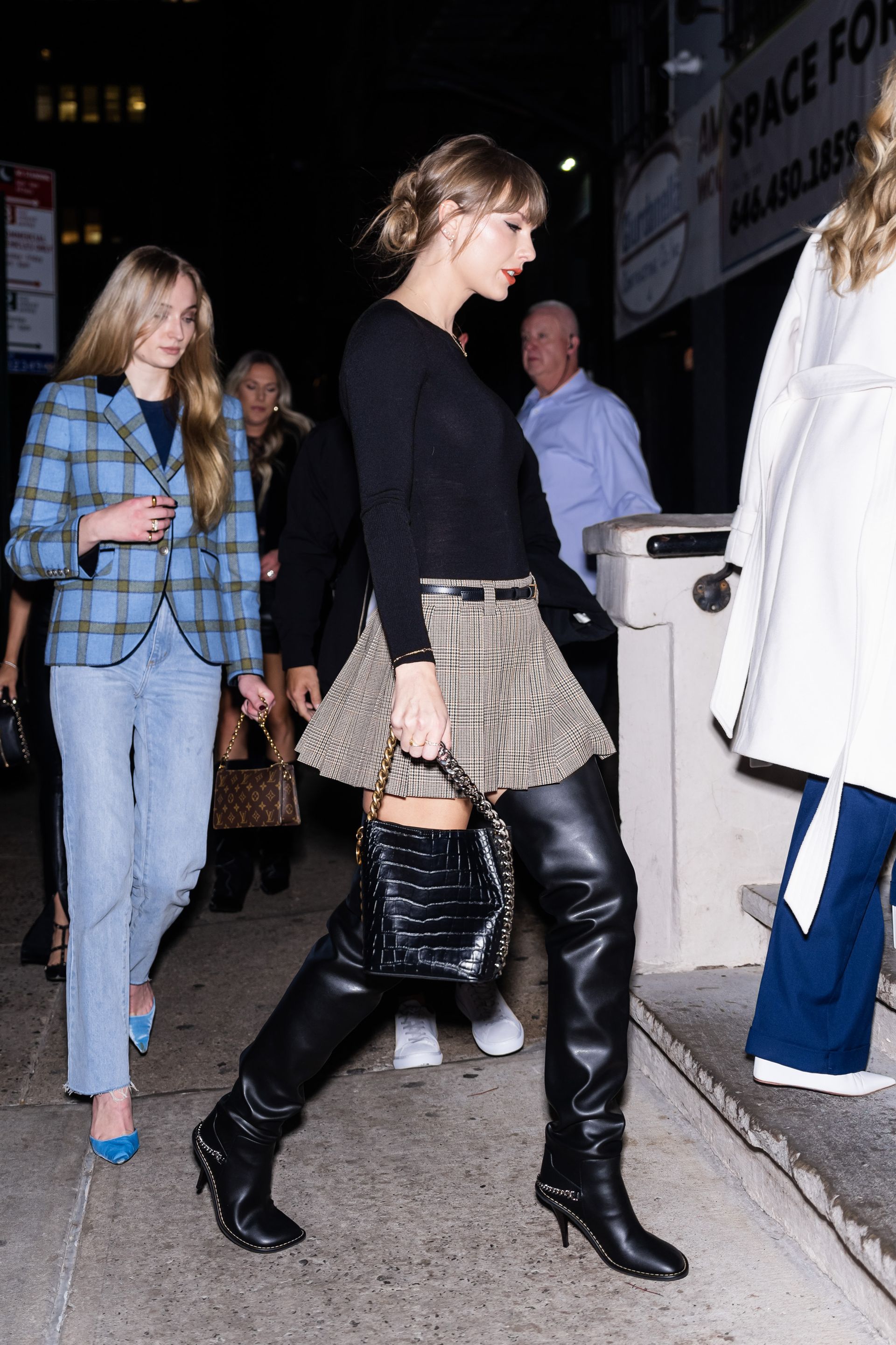 <p>                     Without ever having to say a word to the press, Swift showed support for her pal Sophie Turner, in the midst of a contentious divorce with Joe Jonas, by taking her out to dinner. The simple act proved wildly popular, and Turner and Swift were spotted again with a group of girls (including Selena Gomez). Love the thigh high boots and plaid mini, too.                   </p>