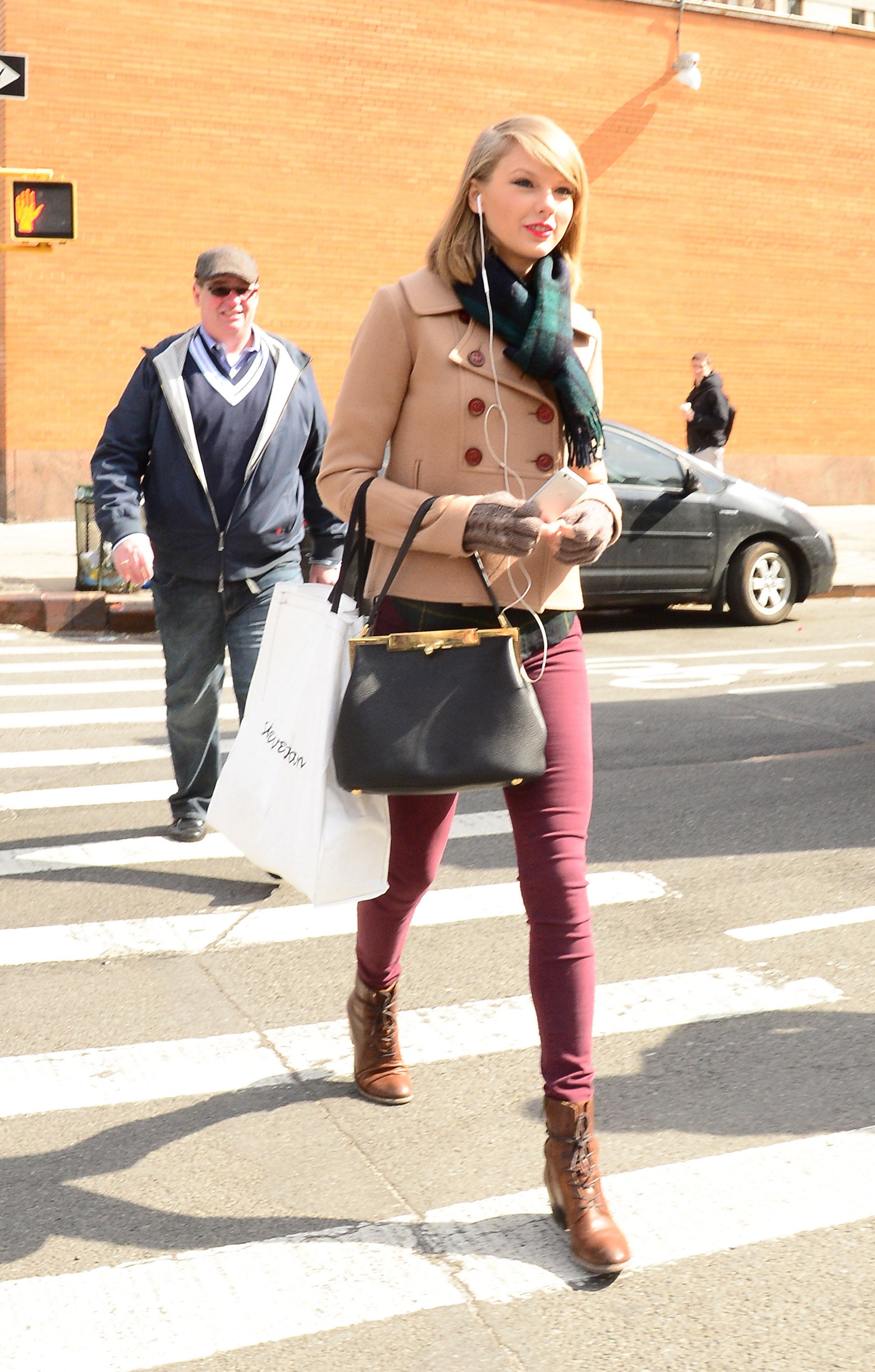<p>                     Actually, this might be the most fall outfit of all time (even though this photo was taken in spring). Plum-colored pants, an upscale tan short coat, plaid scarf and top, brown boots, black bag, and (of course) red lip: a classic matchy-matchy mid-10s Taylor Swift look.                   </p>