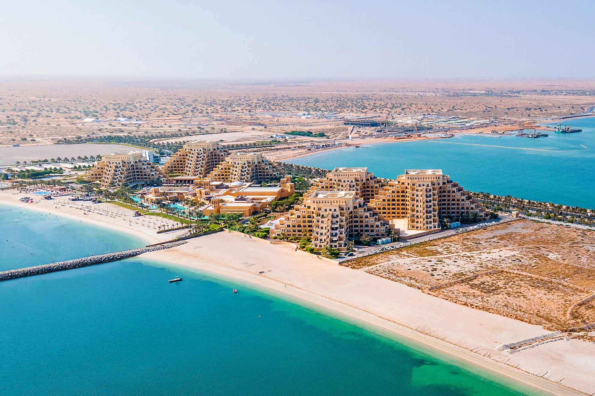 <p><strong>Why you should go:</strong> Seaside vibes in Dubai's under-the-radar neighbor to the north</p> <p>Dubai is always popular, and always full of flashy new attractions and frenetic energy. But if you want an Emirates vacation that's a little more relaxing, head 40 minutes north of the city to this under-the-radar gem. Well, under the radar until 2024, that is, when the luxury Anantara Mina Al Arab Ras Al Khaimah Resort opens and more people realize that it's one of the best places to travel. It's set amid the area's stunning mountains and mangroves in the seaside neighborhood of Mina Al Arab, which is quickly becoming a trendy destination, with new openings and plenty of sunshine.</p> <p>Ras Al Khaimah is a great spot for outdoorsy types, who can snorkel or swim in the crystal-clear turquoise waters, then head off for a quad biking adventure in the desert or soar over the desert on the world's longest zipline. And speaking of world records: If you get a chance to spend New Year's Eve here, don't miss it. The Emirate holds multiple Guinness World Records for its spectacular fireworks performances held during its New Year's celebrations.</p> <p><strong>Where to stay:</strong> The <a href="https://www.anantara.com/en/mina-al-arab-ras-al-khaimah" rel="noopener noreferrer">Anantara Resort</a> here is more than just a getaway from the bustling city. It also boasts Bali-style overwater bungalows for an over-the-top <a href="https://www.rd.com/list/romantic-getaways/" rel="noopener noreferrer">romantic getaway</a>.</p> <p class="listicle-page__cta-button-shop"><a class="shop-btn" href="https://www.anantara.com/en/mina-al-arab-ras-al-khaimah">Book Now</a></p> <h2 class="">About the experts</h2> <ul> <li><strong>Heather Heverling</strong> is the president and managing director (North America) at <a href="https://www.audleytravel.com/us/" rel="noreferrer noopener">Audley Travel</a>, a custom tour operator that designs trips to more than 75 destinations around the world, each tailored to the client's budget, interests and travel style.</li> <li><strong>Nick Cunningham </strong>is the European destination manager for <a href="https://www.scottdunn.com/us" rel="noreferrer noopener">Scott Dunn</a>, a bespoke tour company offering luxury and highly customized travel experiences.</li> <li><strong>Melanie Fish</strong> is a travel expert at <a href="https://www.expedia.com" rel="noreferrer noopener">Expedia</a>.</li> <li><strong>Brady Binstadt </strong>is the CEO of <a href="https://www.geoex.com/" rel="noreferrer noopener">GeoEx, or Geographic Expeditions</a>, a travel adventure company.</li> <li><strong>Vasco Borges</strong> is the owner of <a href="https://www.beachenclave.com" rel="noreferrer noopener">Beach Enclave Turks and Caicos</a> and an avid kiteboarder.</li> </ul>
