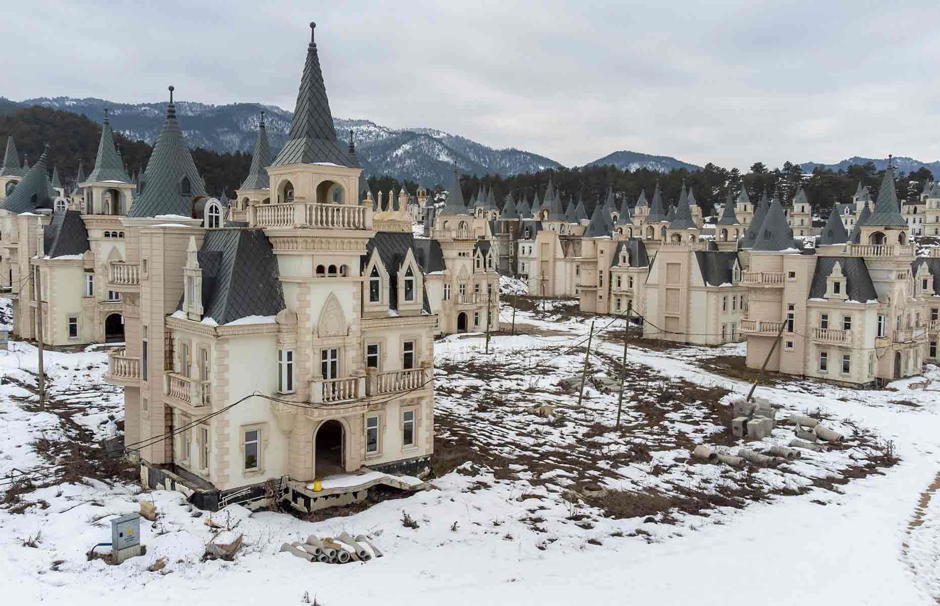 <p>This image shows the villas shrouded in snow in February 2022. While their architecture is still grand and stately, many are open to the elements, the winter frost no doubt wreaking havoc on the structures. A power line appears to run through the site, but it looks less than stable, and discarded construction materials litter the frozen ground.</p>  <p>If, or when, this deserted development will be completed is anyone's guess. The Sarot Group's CEO Mezher Yerdelen vowed to have the project done and dusted in 2021, a pledge made before the coronavirus pandemic hit. Two years on, that ambitious deadline was clearly never met.</p>