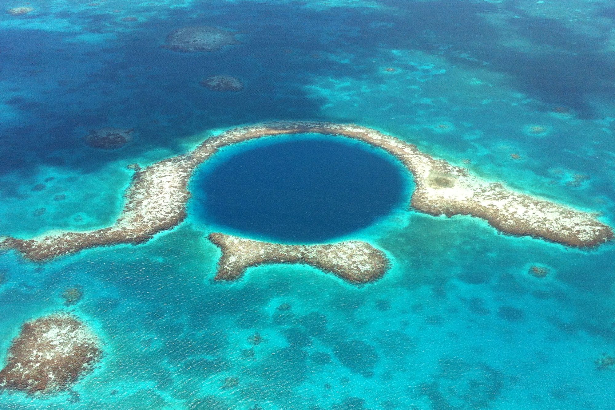 <p class=""><strong>Why you should go:</strong> The second-largest barrier reef in the world</p> <p>Have you heard of the Great Barrier Reef? We thought so. How about Belize's Barrier Reef? Not so much, right? We're here to tell you that in 2024, it's time to put this <a href="https://www.rd.com/article/7-natural-wonders-of-the-world/">natural wonder</a> on your must-visit list. The world's second-largest barrier reef (behind Australia's), it is actually the biggest reef in both the northern and western hemispheres. The snorkeling here is magnificent, and so is the diving—plus, it's not as crowded as the better-known Australian alternative. Even better, Belize is easy to reach, one of the safest countries in the world and an affordable place to visit. It's also one of the foreign countries that uses U.S. dollars.</p> <p>If you're looking for the perfect home base while visiting, consider Belize's largest island, Ambergris Caye. The Belize Barrier Reef is just a quarter-mile offshore, and you'll definitely want to check out the protected Hol Chan Marine Reserve, which is just a 10-minute boat ride from the main town of San Pedro. When you're not snorkeling or swimming, spend your days popping into Belizean art galleries and souvenir shops or just lounging on the white sand.</p> <p><strong>Where to stay:</strong> Try the <a href="https://www.tripadvisor.com/Hotel_Review-g291962-d21309594-Reviews-Alaia_Belize_Autograph_Collection_Hotel-San_Pedro_Ambergris_Caye_Belize_Cayes.html" rel="noopener noreferrer">Alaia Belize</a>, an Autograph Collection hotel in the island's historic town of San Pedro. This beachfront hotel is just 650 yards from the Belize Barrier Reef Reserve and has stunning views of the Caribbean Sea. Plus, it has an on-site dive shop and three pools, including Belize's first-ever suspended rooftop pool and a lounge with 360-degree views.</p> <p class="listicle-page__cta-button-shop"><a class="shop-btn" href="https://www.tripadvisor.com/Hotel_Review-g291962-d21309594-Reviews-Alaia_Belize_Autograph_Collection_Hotel-San_Pedro_Ambergris_Caye_Belize_Cayes.html">Book Now</a></p>