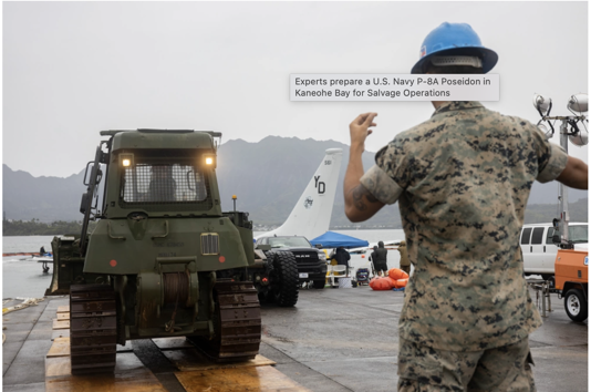 Experts prepare for salvage operation of U.S. Navy surveillance plane stuck on Hawaiian coral reef.  / Credit: U.S. Navy