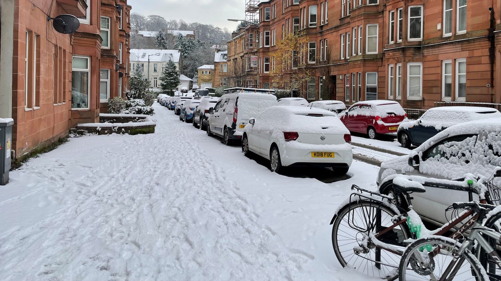 Weather in pictures: Snow starts to settle in UK as German city faces