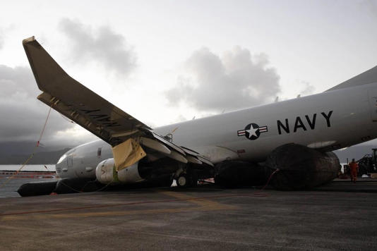 A multidisciplinary team of military and civilian salvage experts extract a U.S. Navy P-8A Poseidon from waters just off the runway at Marine Corps Air Station Kaneohe Bay, Marine Corps Base Hawaii, Dec. 2, 2023.  / Credit: U.S. Marine Corps Photo by Lance Cpl. Tania Guerrero