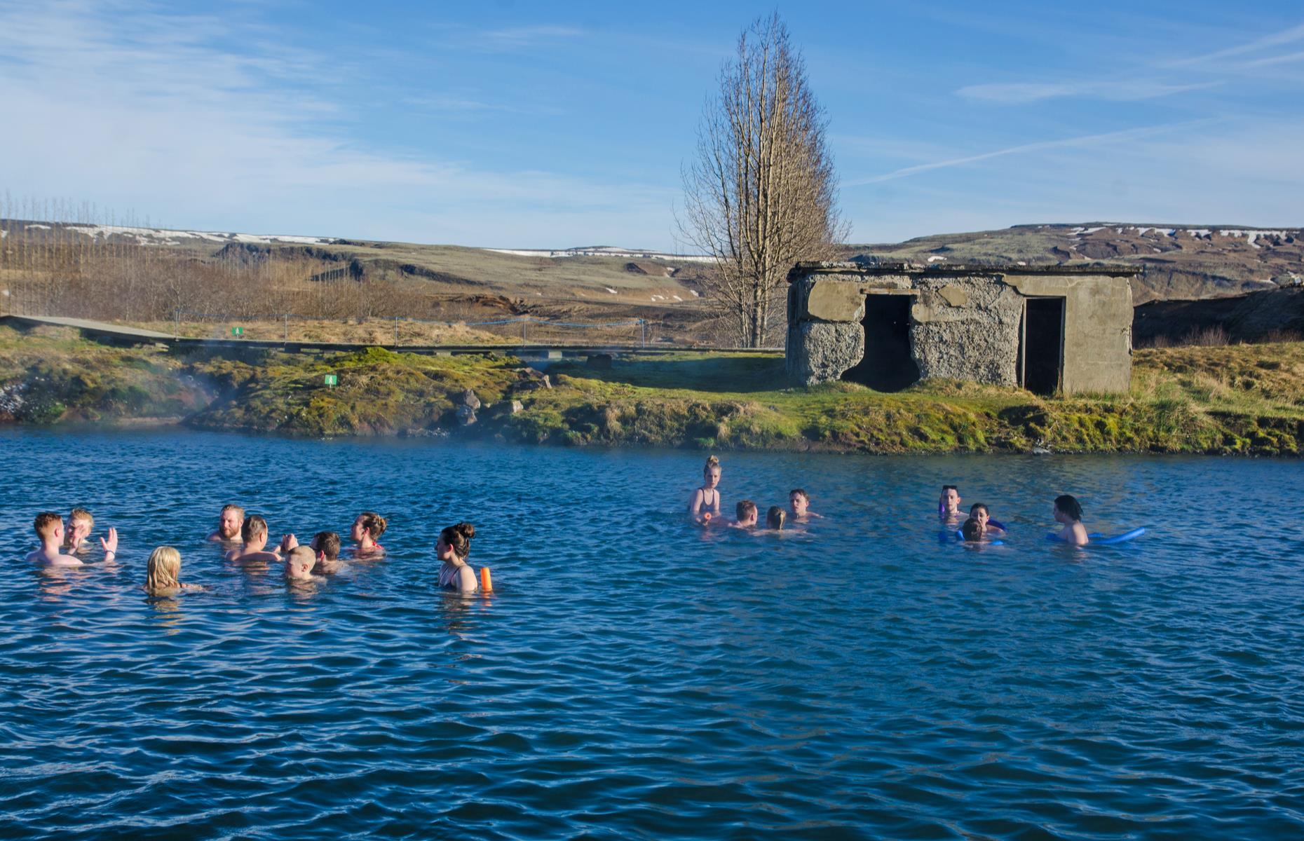 <p>The Blue Lagoon is one of Iceland’s most famous postcards, but the prohibitive price tag and popularity of the geothermal baths has led more adventurous travellers to look for alternatives like the <a href="http://secretlagoon.is/">Secret Lagoon</a>. It’s easily accessible from Reykjavík, in the small town of Flúðir (that also boasts a surprisingly fun <a href="http://fridheimar.is/en">tomato farm</a>).</p>  <p>Built as a public swimming pool in 1947, the lagoon is heated by bubbling hot springs nearby which you can wander around – just don’t fall in as temperatures exceed 100°C (212°F).</p>