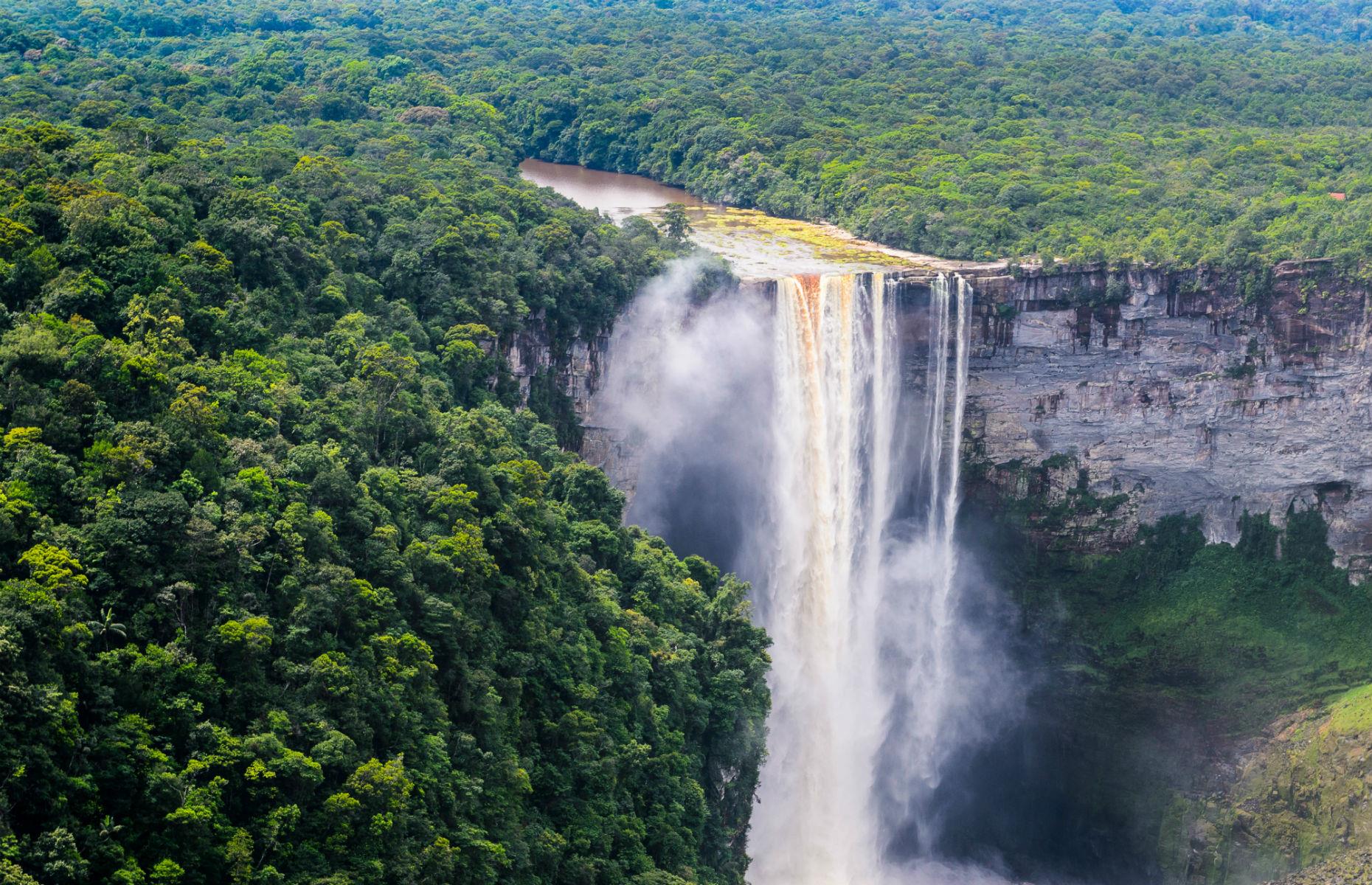 <p>To visit a waterfall that’s just as powerful and impressive as Niagara Falls or Iguazu Falls but with a fraction of the crowds and tourists, you need to head to Guyana’s Kaieteur Falls in the verdant Kaieteur National Park. Five times taller than Niagara, this is the world’s highest single-drop waterfall, and with 30,000 gallons of water thundering over the 820-foot cliff, visiting is a memorable, beautiful, and noisy experience.</p>