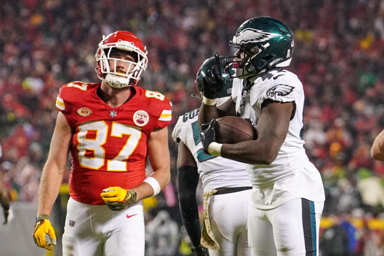 Philadelphia Eagles linebacker Nicholas Morrow (41) celebrates after recovering a fumble as Kansas City Chiefs tight end Travis Kelce (87) reacts during the second half at GEHA Field at Arrowhead Stadium.