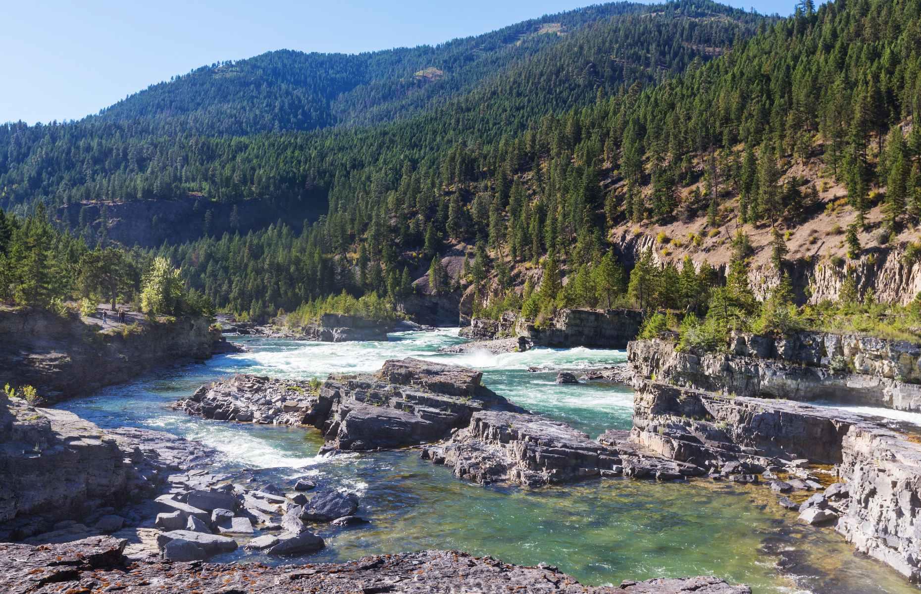 <p>The largest undammed falls in Montana (and one of the largest free-flowing falls in the American northwest), Kootenai Falls is certainly impressive. The rushing cascade sits on the sacred lands of the Kootenai Tribe, to whom the falls represent the center of the world.</p>  <p>Community members come here for spiritual guidance and direction from their ancestors. For visitors, this is a place to feel grounded and close to nature. Follow the forest trail from the parking lot down to the Swinging Bridge, which promises a great perspective of the falls if you’ve got a head for heights (and aren’t put off by the wobble).</p>