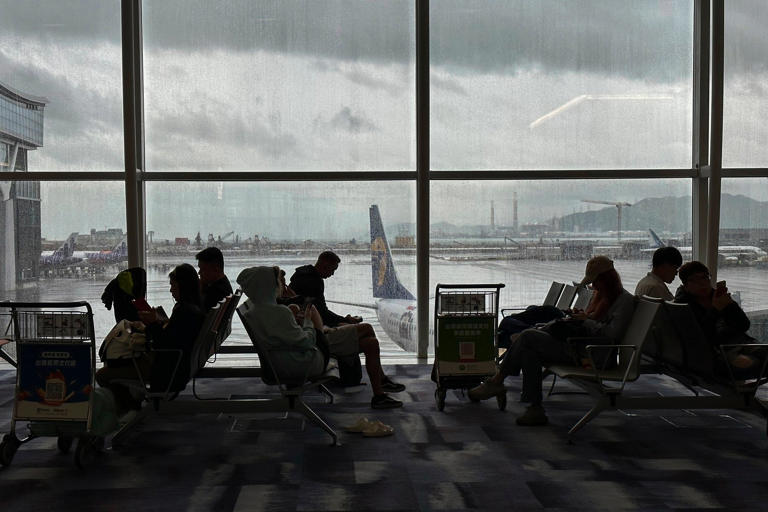 Travellers wait at the departures hall at Hong Kong International Airport. About 172,500 city residents applied for the BN(O) visa scheme between January 2021 and March this year. Photo: AP