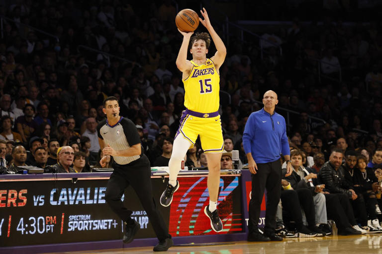 Lakers guard Austin Reaves launches a last second half-court shot, but is a tick too late to beat the buzzer against the Mavericks Wednesday night at Crypto.com Arena. ((Robert Gauthier/Los Angeles Times))