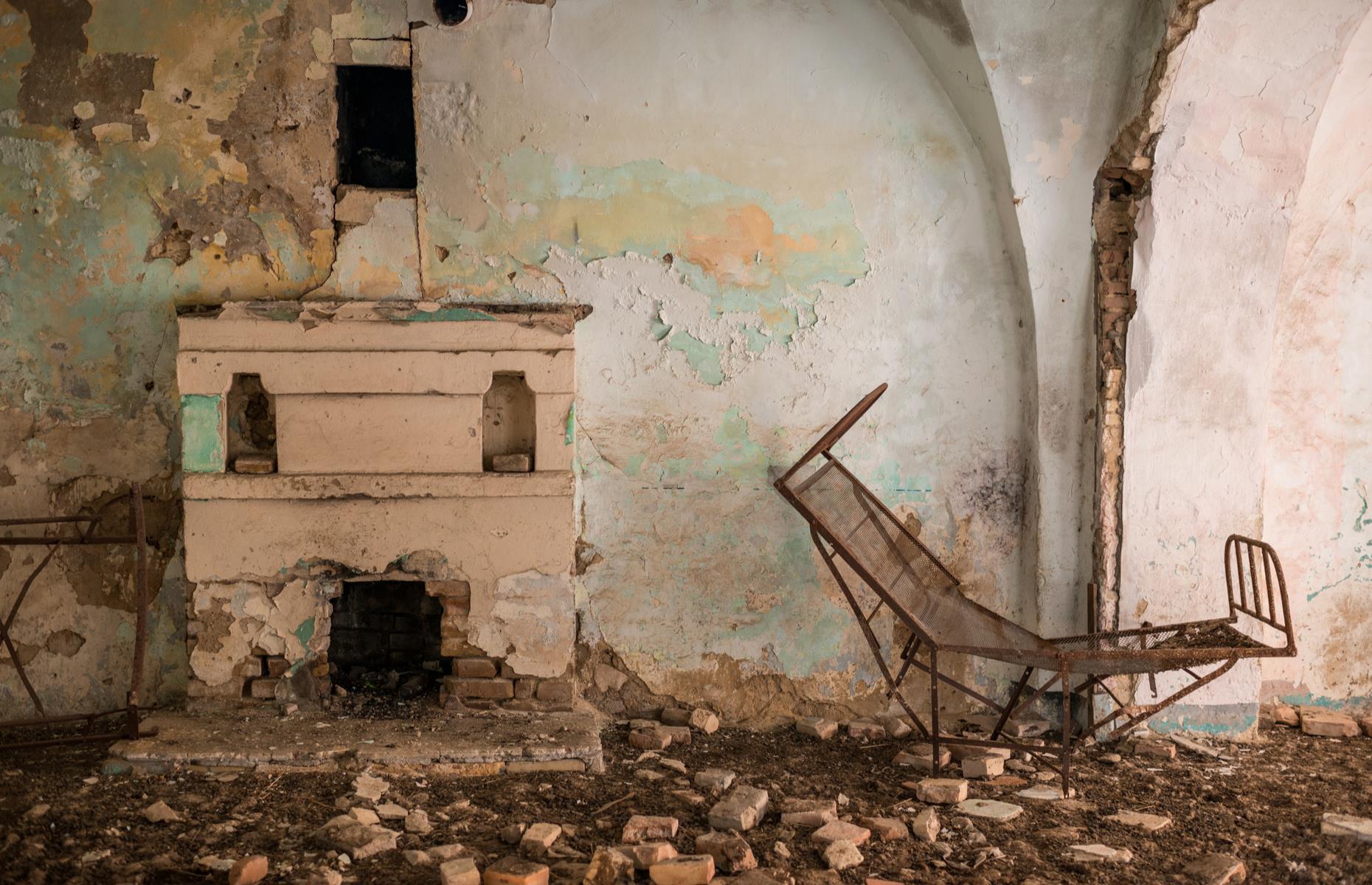 <p>Inside the remaining buildings, signs of domesticity remain, with a hearth and bed frame still visible in this dilapidated house. These days Craco is blocked off for safety reasons, however, private guided tours are now available for curious tourists.</p>