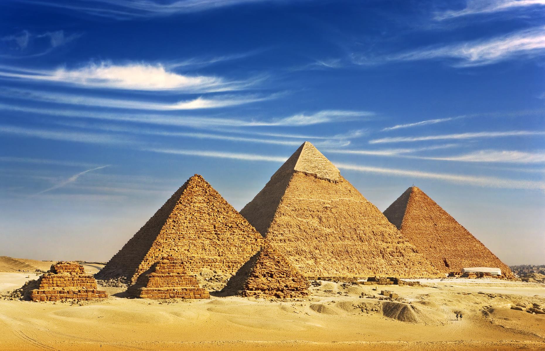 Built between 2584 BC and 2561 BC, the Great Pyramid of Giza is the only surviving of the Seven Wonders of the Ancient World and has enthralled travellers for millennia. As you see the gargantuan structure and the other pyramids rise from the desert just outside of Cairo, you can't fail to be awed by the enormity of their size and history.