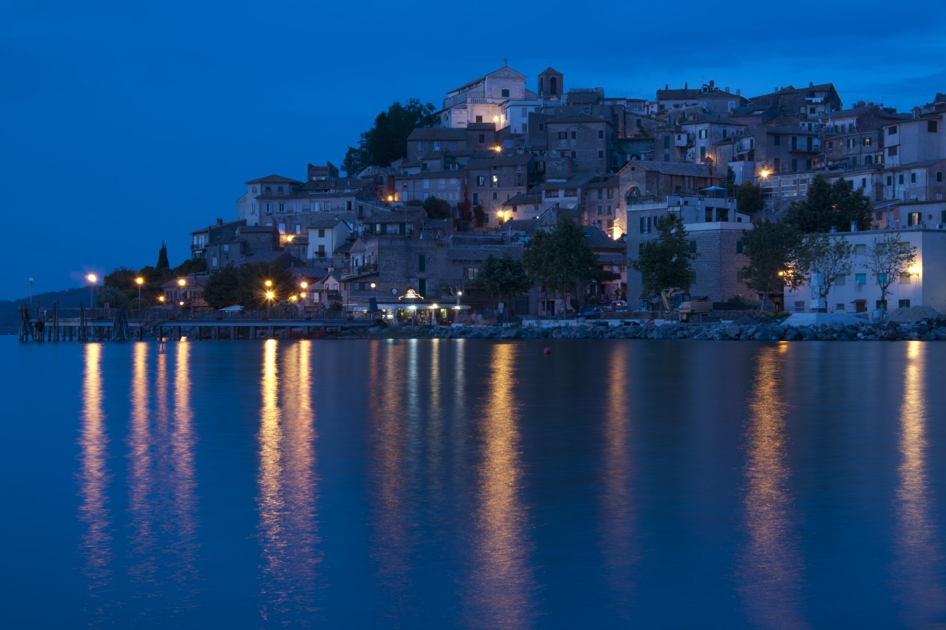 <p>This splendid village is reflected in the waters of Lake Bracciano - where it is possible to swim! It is located just over 30 km (18.5 miles) from the capital and ideal for day trip. The town offers postcard views from any side you look at it. Not to be missed, especially at sunset.</p>