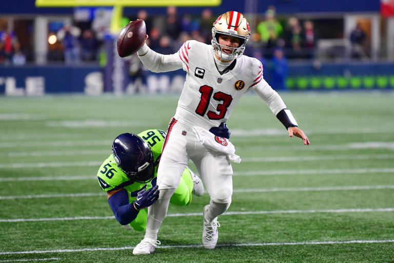 San Francisco's Brock Purdy completed 21 of 30 passes for 209 yards, a touchdown and a pick 6 in Thursday night's victory against Seattle. (Photo by Jane Gershovich/Getty Images)