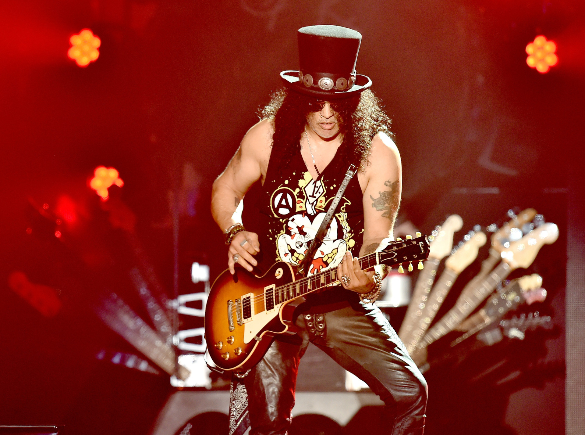 <p>The Slash costume has remained a popular choice for Halloween due to its association with the big hair and top hat look. Pair up with a friend dressed as Axl Rose to rock this iconic duo!</p>