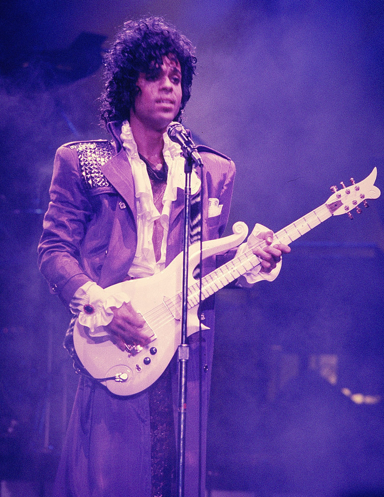 <p>Prince's iconic fashion choices, including his abundance of V-necks, shimmer, and sparkle, are remembered fondly by fans. However, it is his high-collared purple suit, ruffled white shirt, and curly-haired look from the 'Purple Rain'-era that truly holds a special place in their hearts.</p>