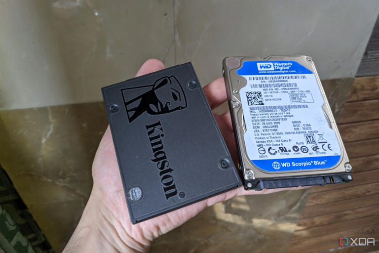 An image of a Kingstone SSD kept adjacent to a WD hard drive.