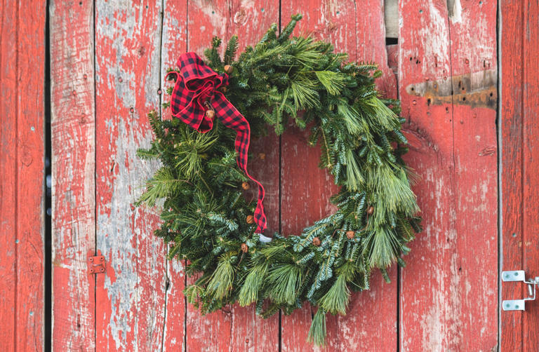Christmas Wreath Hanging on Red Barn Door
