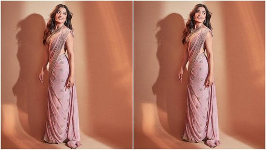Her saree, sourced from the shelves of ace designer Arpita Mehta, features a captivating shade of pink, rich georgette fabric adorned with an intricate baby orchid mirror and sequential hand embroidery all over. She paired it with a matching halterneck backless blouse.