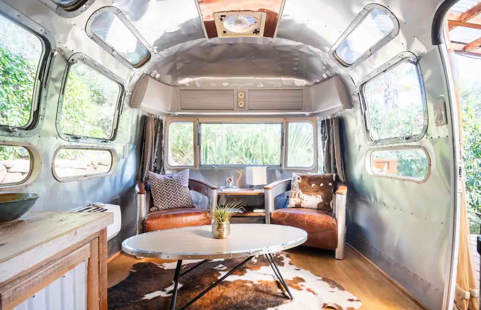 <p>At one end of the <a href="http://www.airbnb.co.uk/rooms/20068886">Airstream</a>, you'll find a double memory foam bed, while at the other there's a stylish seating area where you can kick back beneath that spectacular metal roof. Outside, a shady wooden deck with a gas firepit is the perfect place for dining alfresco.</p>  <p>There's also a separate structure containing a full bathroom and laundry facilities, alongside a beautiful garden and even a small avocado orchard. We can’t imagine ever wanting to leave this Cali hideaway!</p>