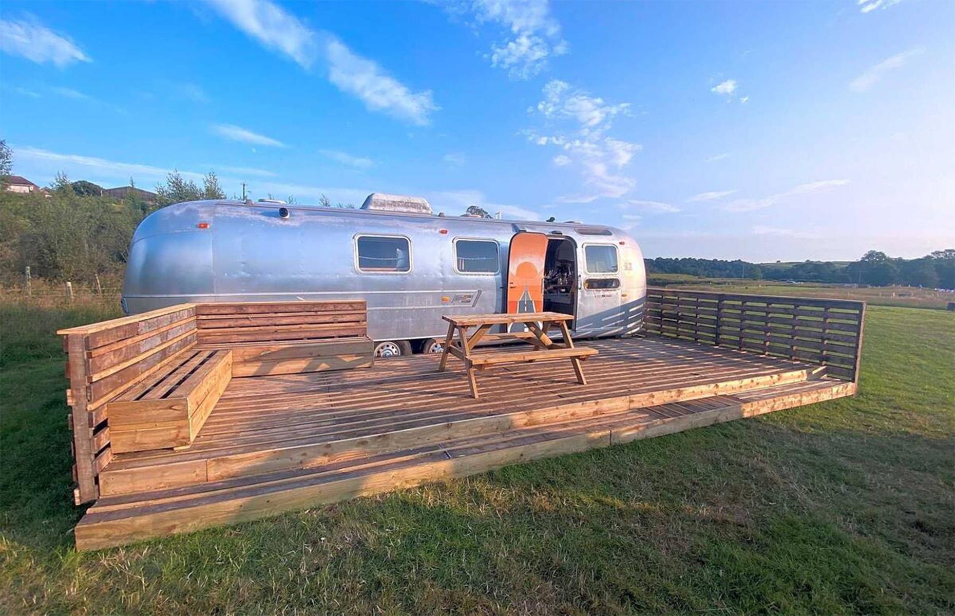 <p>Big Bertha, as this 1973 Airstream has affectionately been dubbed, truly lives up to her name with a sleeping capacity of up to six people.</p>  <p>Situated in the English countryside overlooking Croglin Beck, the Airstream <a href="https://www.airbnb.co.uk/rooms/52216553">Airbnb</a> has been sleekly renovated to afford all the comforts of a true ‘glamping’ experience.</p>