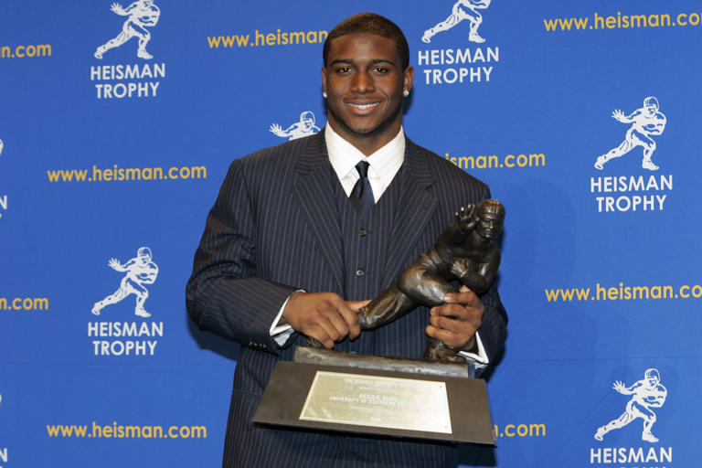 Reggie Bush, University of Southern California tailback holds the Heisman Trophy during the 2005 Heisman Trophy presentation at the Hard Rock Cafe in New York City, New York on December 10, 2005. Bush received 2,541 points in the ballot. (Photo by Michael Cohen/WireImage) Michael Cohen/Getty Images
